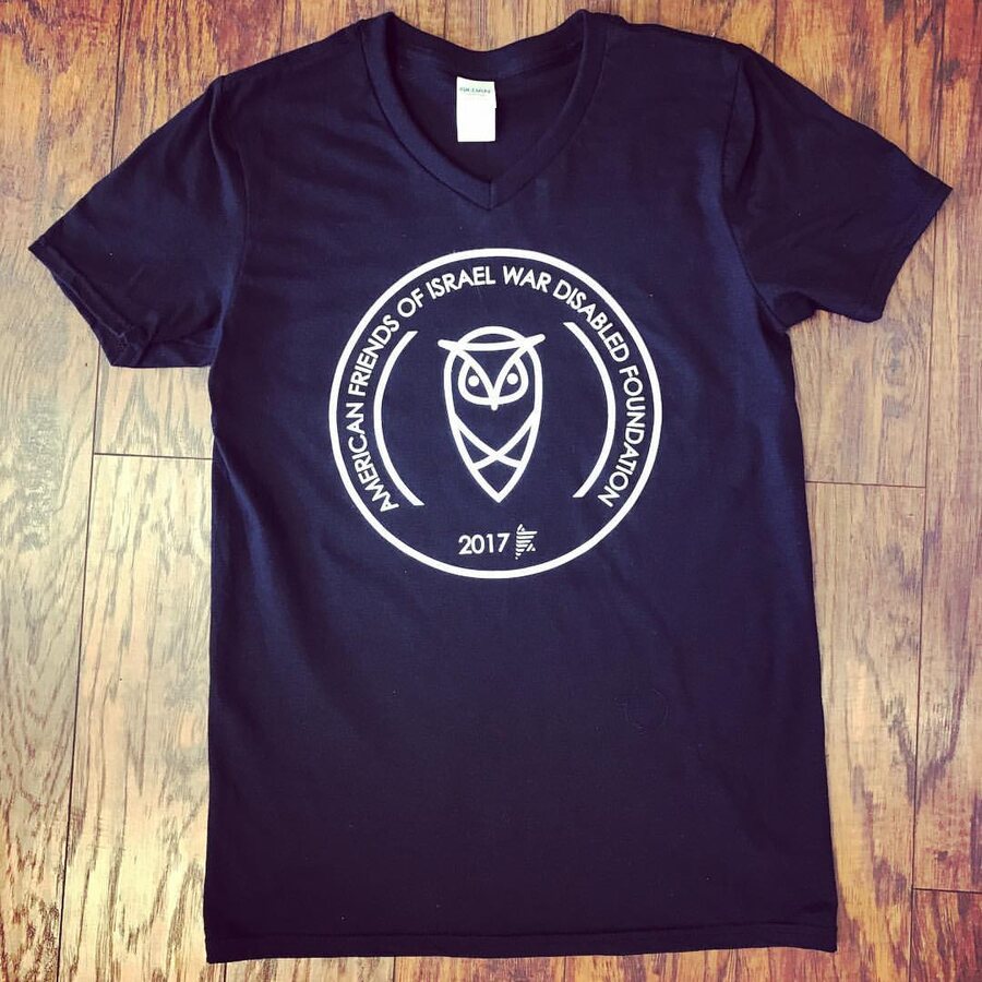 Charity foundation tee with an owl crest